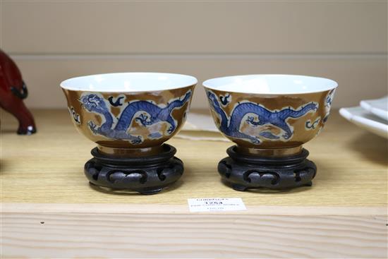 A pair of Chinese cafe au lait glazed dragon bowls Diameter 10.5cm.